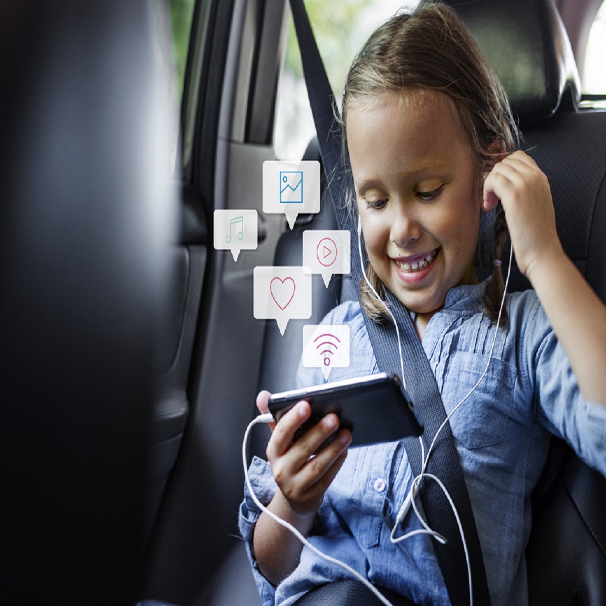 Little Girl Using A Phone In A Car